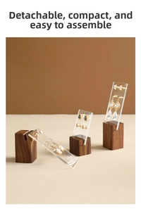 Macro detail of walnut wood and acrylic earring stand with easy assembly design