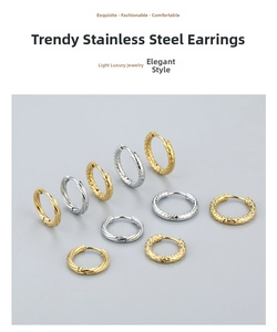 Detailed view of textured stainless steel hoop earrings in gold and silver finishes