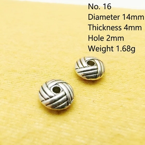 Detailed view of woven texture silver spacer beads measuring 14mm with 2mm hole