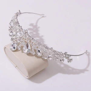 Close-up of silver leaf crown featuring sparkling rhinestones and drop gems