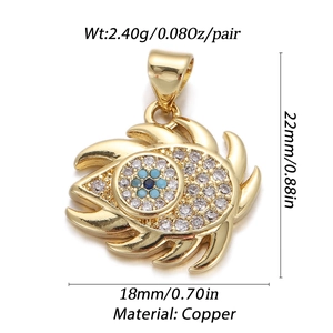 Detail view of gold-plated copper evil eye pendant with blue crystals and dimensions