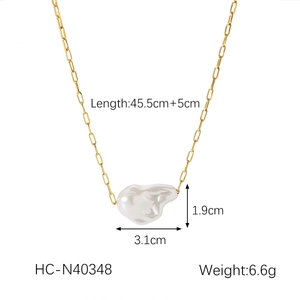 Close-up of 18K gold stainless steel chain with irregular white baroque pearl pendant