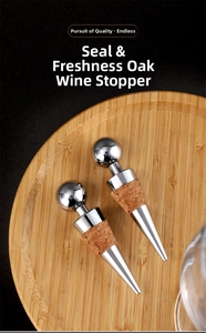 Close-up of zinc alloy round top wine stoppers with sealing silicone on a wooden tray