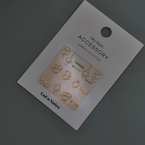 Detailed view of MJ-051 nail art stickers with golden metal frames and white pearls