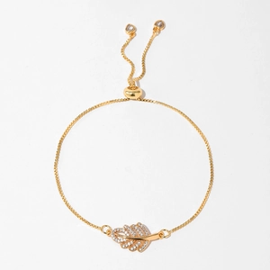 Macro shot of gold leaf pendant with white zircons and adjustable bolo slider box chain