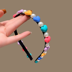 Chic thin headband with colorful heart beads and white faux pearls on a black frame