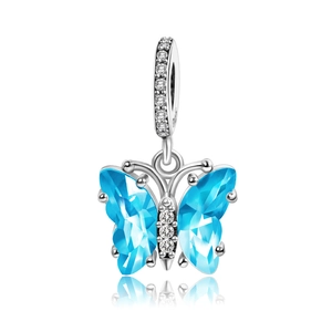 Sterling silver butterfly charm with faceted blue crystal wings and sparkling cz accents