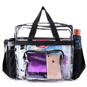 Large transparent PVC travel bag with black handles showing spacious interior storage