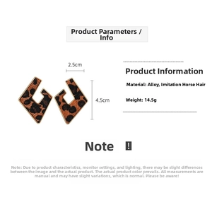 Detail view showing dimensions of flocking leopard print geometric heart earrings