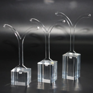 Three transparent acrylic earring stands in various heights with Y-shaped jewelry holders