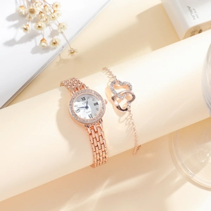 Elegant rose gold women's watch set with rhinestone bezel and matching heart bracelet