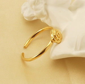 Detail of 18K gold plated rose flower ring showing petal texture and adjustable open band