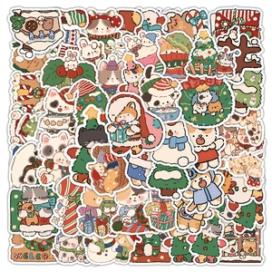 Detailed flat lay of cute Christmas stickers featuring cats, bears, and holiday trees