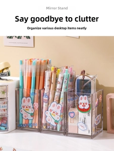 Close-up of a three-grid acrylic organizer with cute cartoon stickers and stationery