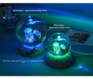 Detail view of 3D jellyfish crystal ball night lights in 6cm and 8cm sizes with resin bases