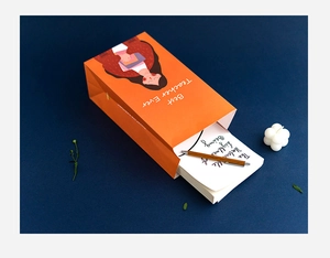 Orange Teacher Appreciation gift box set with wood pen and art cards on blue background