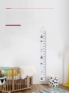 Space-themed canvas growth chart for kids room with wooden frame measuring 10-190cm