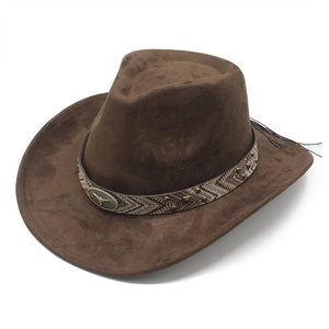Detail of suede cowboy hat with woven band and vintage bronze bull head metal emblem