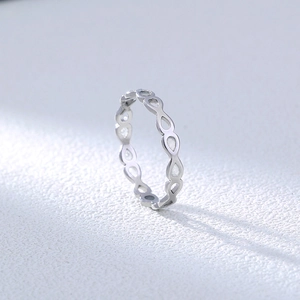 Detailed side view of silver hollowed water drop pattern ring made of 304 stainless steel