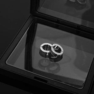 Silver stainless steel clip-on earrings with Nordic runes in a black display box