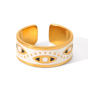 Macro detail of gold-plated evil eye ring with black and white enamel drip oil finish