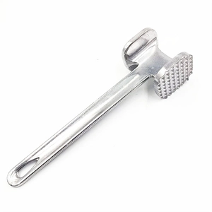 Detailed close-up of a dual-sided metal meat mallet showing textured tenderizing surface