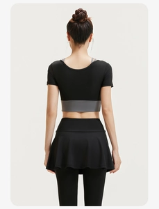 Rear view of two-piece yoga set with black crop top and layered skirt leggings