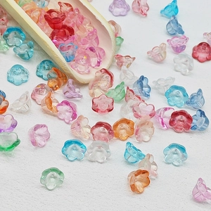 Close-up of colorful lily of the valley glass beads for DIY jewelry making accessories