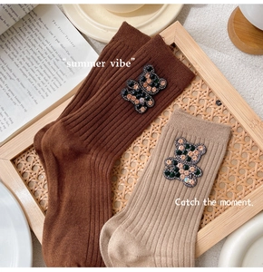 Detailed knit ribbed socks with sparkling rhinestone bear patches in brown and beige