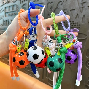 Colorful soccer ball keychains with woven ropes and carabiners shown in multiple vibrant styles