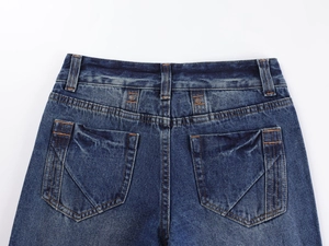 Close-up of back pockets and waist details on vintage low-waist straight leg jeans
