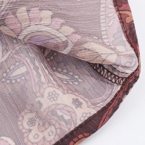 Bohemian paisley chiffon blouse detail with intricate woven texture and stitching