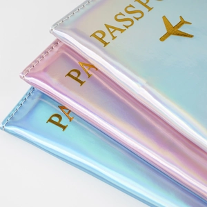Macro shot of holographic laser PU leather passport covers with gold foil logo details