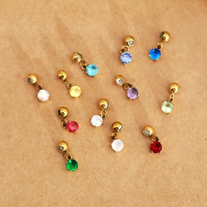 Mini zodiac birthstone pendants with 18K gold plating in various colorful round crystals