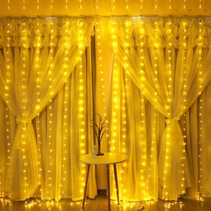 Warm white LED curtain string lights hanging elegantly on a window for home decoration