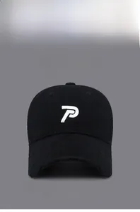 Close-up of distressed brim detail and white 'P' embroidery on vintage black baseball cap