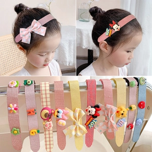 Detailed view of elastic hair bands featuring cute cartoon characters and vibrant patterns