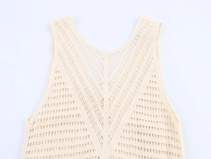 Close-up of the hollow geometric crochet knit texture on this cream summer vest