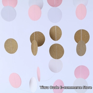 Detail of pink, white, and gold glitter paper circle garlands for party decorations