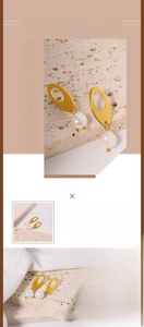 Macro detail of oval titanium steel stud and natural baroque pearl drop earring texture
