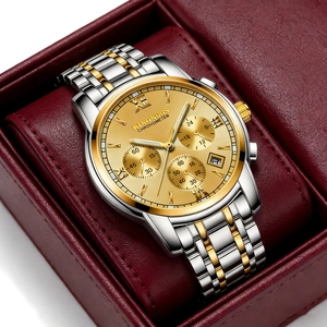 Detailed view of luxury men's two-tone stainless steel watch in a red gift box