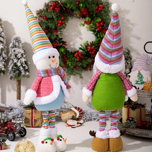 Close-up of colorful Christmas snowman and gnome plush dolls with telescopic long legs