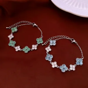 Elegant four-leaf clover bracelet with sparkling cubic zirconia and colored stones