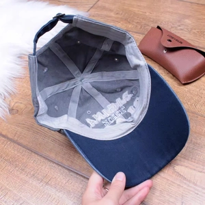 Detailed close-up showing the interior embroidery and stitching of the vintage baseball cap