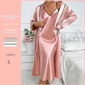 Pink imitation silk sleepwear set with a spaghetti strap dress and belted robe detail