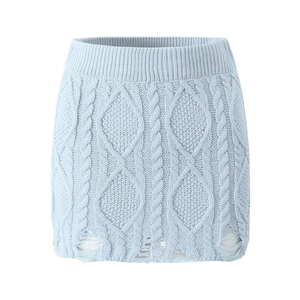 Light blue cable-knit mini skirt with distressed frayed hem on a plain white background
