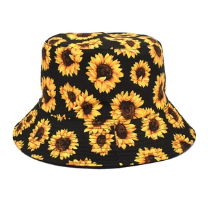 Close-up of sunflower print detail on black cotton bucket hat with flat top design