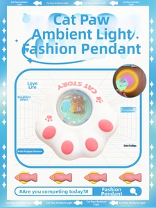 Detail of creative cat paw keychain light showing glowing sunset amber glow and cute design