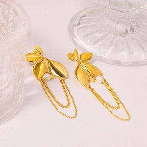 Elegant gold leaf earrings with small pearls and delicate tassel chains on white background