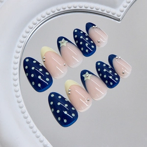 French almond press-on nails set with star pattern and polka dots on heart mirror